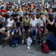 Syrian refugees pack the stands inside the national stadium of the Greek island of Kos August 11, 2015.